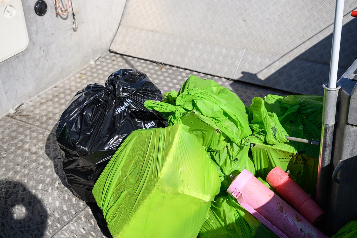 The deck of the Sea Cleaners boat loaded with bags of rubbish pulled from the water